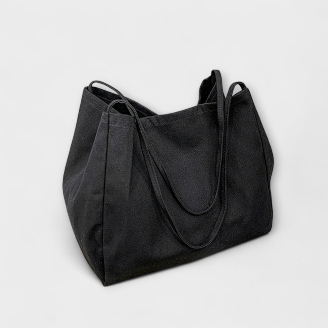 Women's casual everyday tote handbag in a light color, perfect for summer fashion and work use.