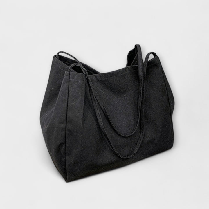 Women's casual everyday tote handbag in a light color, perfect for summer fashion and work use.