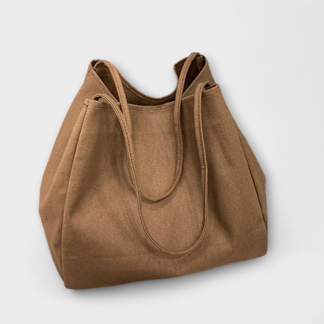 Women's casual tote handbag, a functional and chic accessory, suitable as an everyday or work bag.