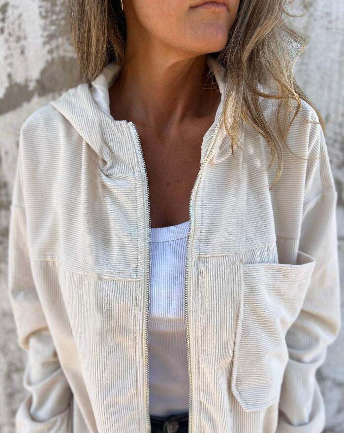 Hip-length women's hooded jacket with a full zip, ideal outerwear for casual outfits.