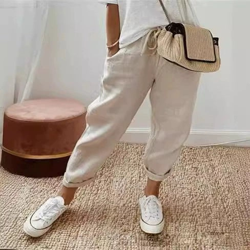 Khaki elastic waist women's chino pants, featuring a relaxed fit for comfortable everyday wear.