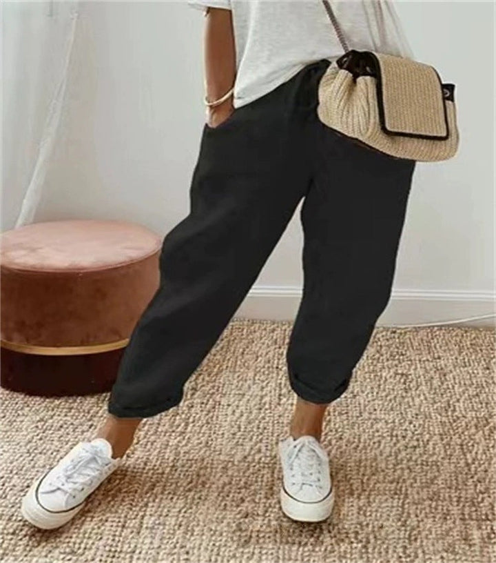 Relaxed fit women's black chino pants with elastic waist, versatile for daily fashion.