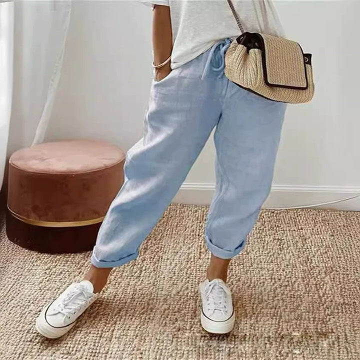 Women's olive green chino pants featuring elastic waist and relaxed fit, a casual fashion bottom.