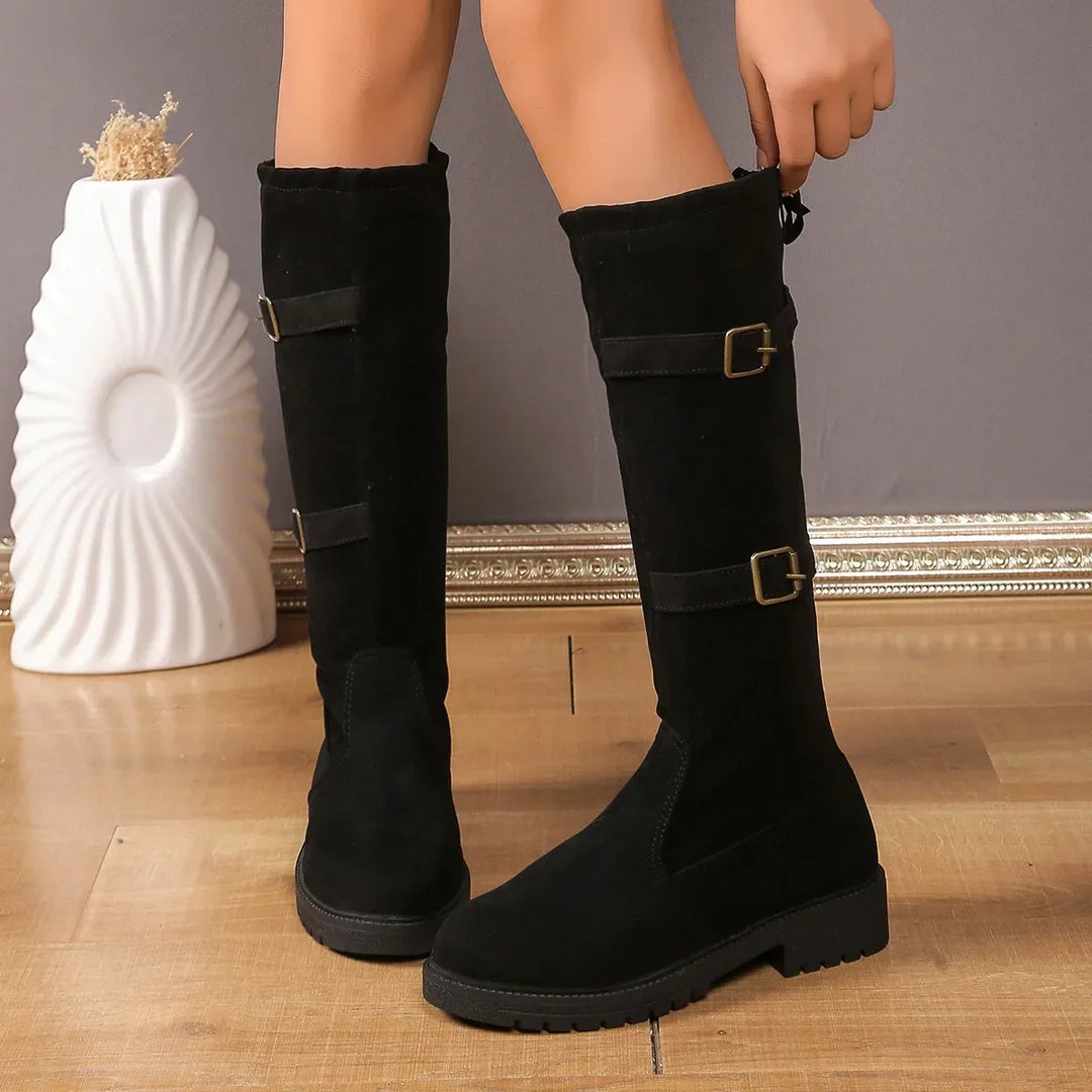 Stylish women's long suede boots feature a chic buckle, ideal for casual winter outfits.