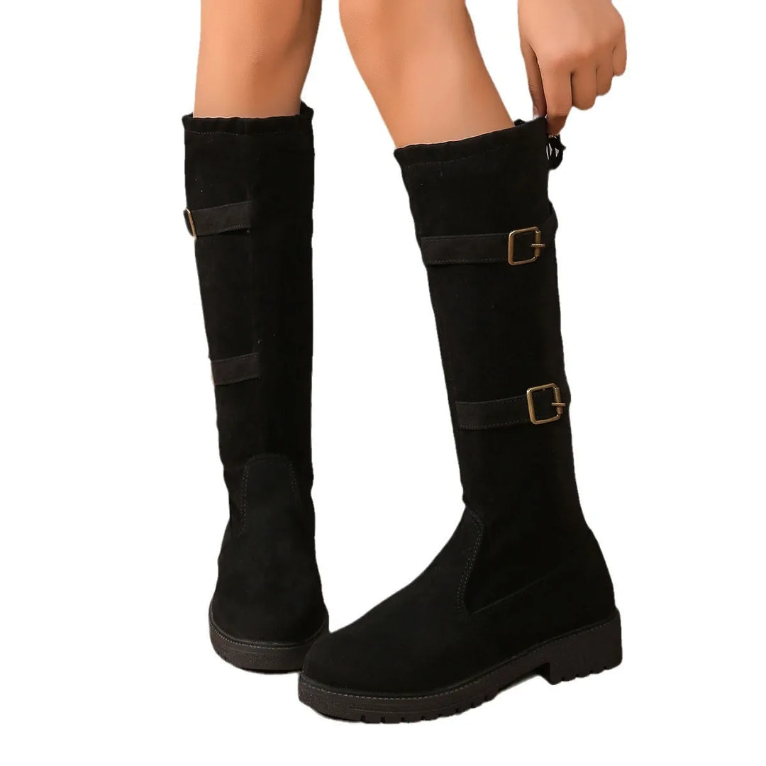 Pair of women's casual suede boots with decorative buckles, offering warmth and style.