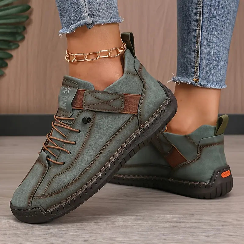 Close-up of women's lace-up walking sneakers, showcasing textured fabric and durable sole for comfort.