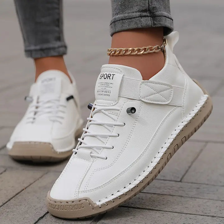 White women's casual footwear, lace-up style, designed for ultimate comfort and versatile everyday use.