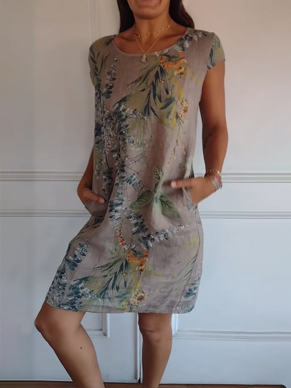 Stylish womensdress featuring a green leaf print, short sleeves, ideal for summer casual fashion.