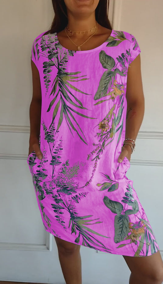Close-up of the leaf print on a women's short sleeve summer dress, showcasing vibrant details.