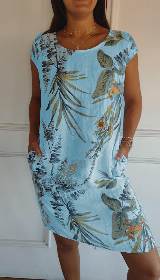 Everyday fashion women's summer dress with an all-over leaf print and practical short sleeves.
