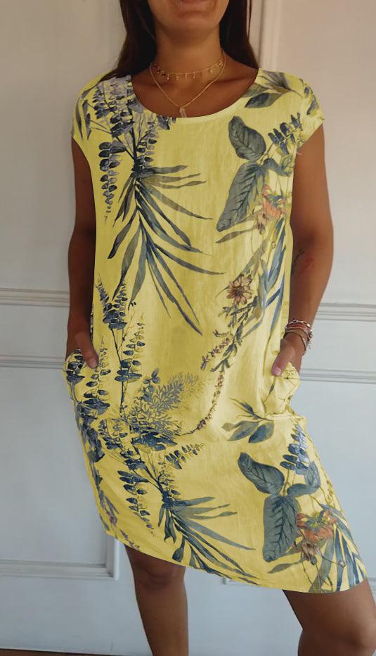 Versatile flowy short sleeve women's leaf print dress, designed for comfortable casual summer wear.
