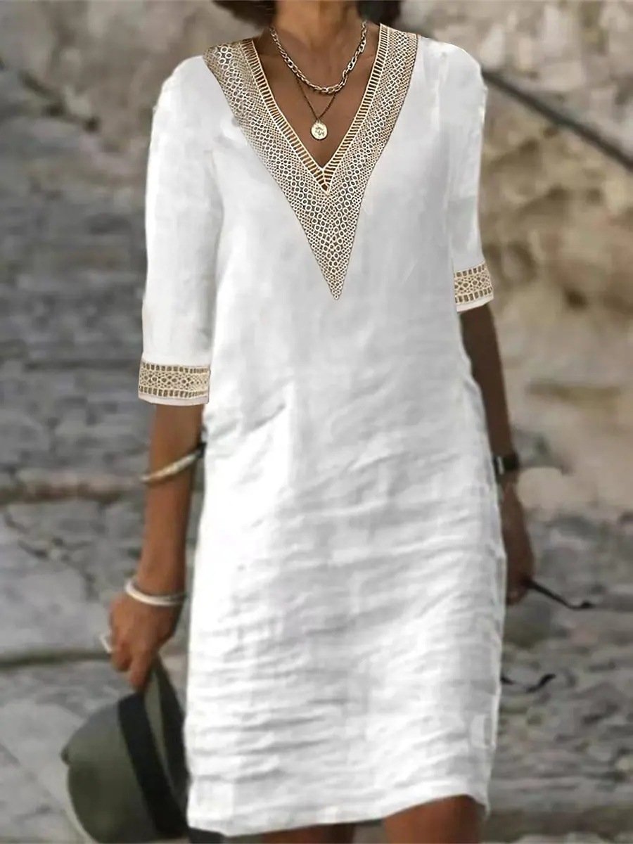 Relaxed fit women's knee-length linen dress with stylish V-neck, lace trim, and comfortable 3/4 sleeves.