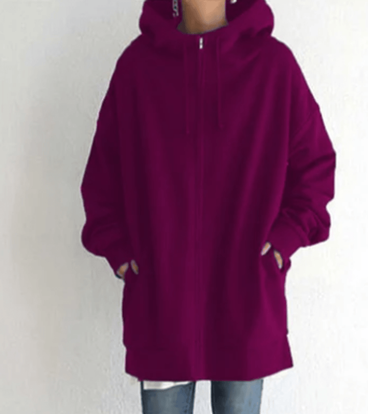 Full length image of a women's oversized long sleeve zip-up hoodie for effortless style