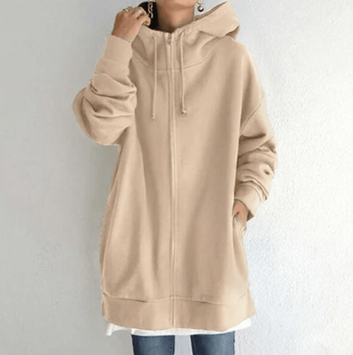 Close-up of a women's long sleeve hooded jacket zipper and soft fabric texture, cozy fall fashion
