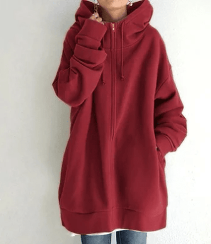Detail of the hood and drawstring on a women's long sleeve zip-up jacket, functional design
