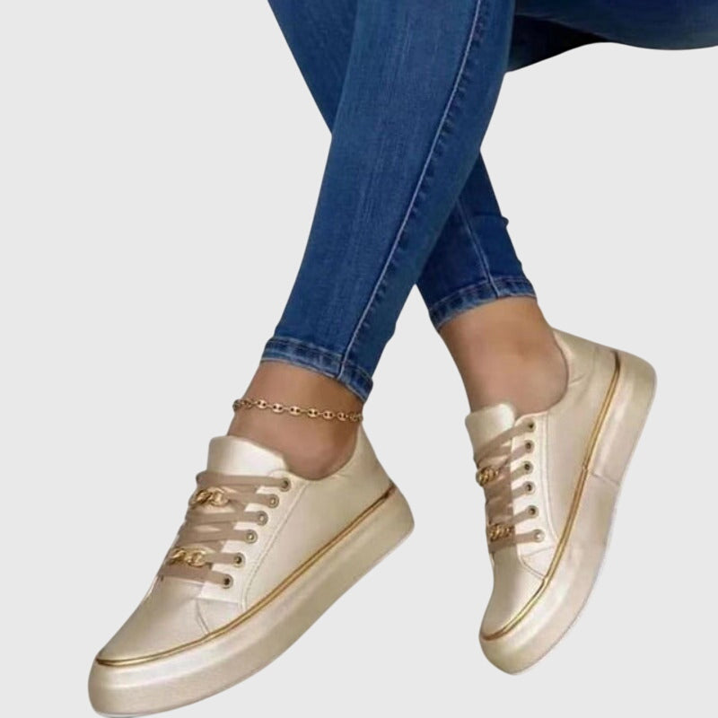 Close-up of the velvet texture and white laces on women's casual low-top sneakers for spring summer.
