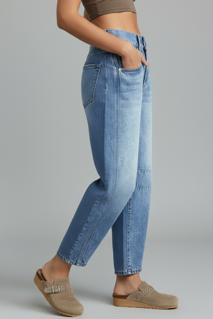Blue mid-rise women's jeans with front closure, perfect for comfortable daily wear.