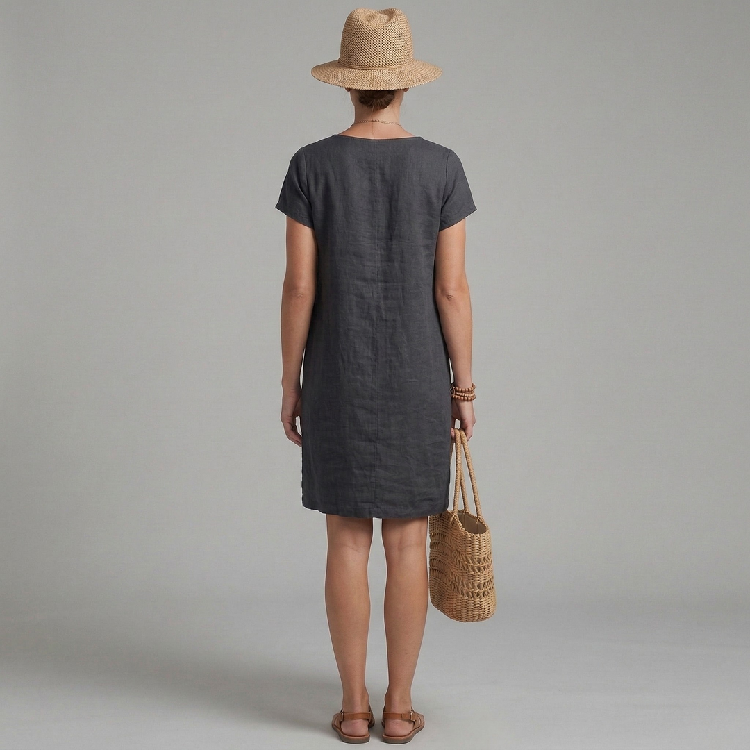 Comfortable women's summer mini dress with short sleeves & front pockets. Ideal for beach, vacation, or casual outfits.