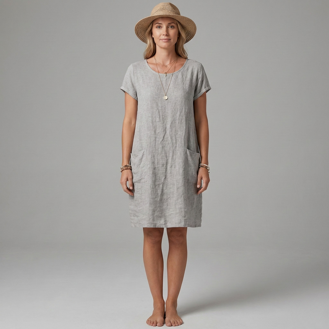 Soft women's casual mini dress with short sleeves & functional front pockets. Comfortable for any casual outing.
