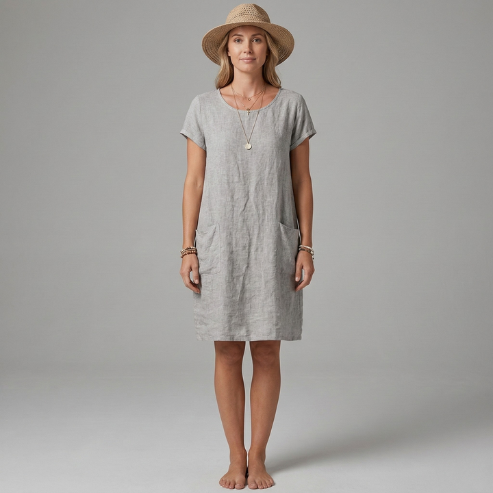 Soft women's casual mini dress with short sleeves & functional front pockets. Comfortable for any casual outing.