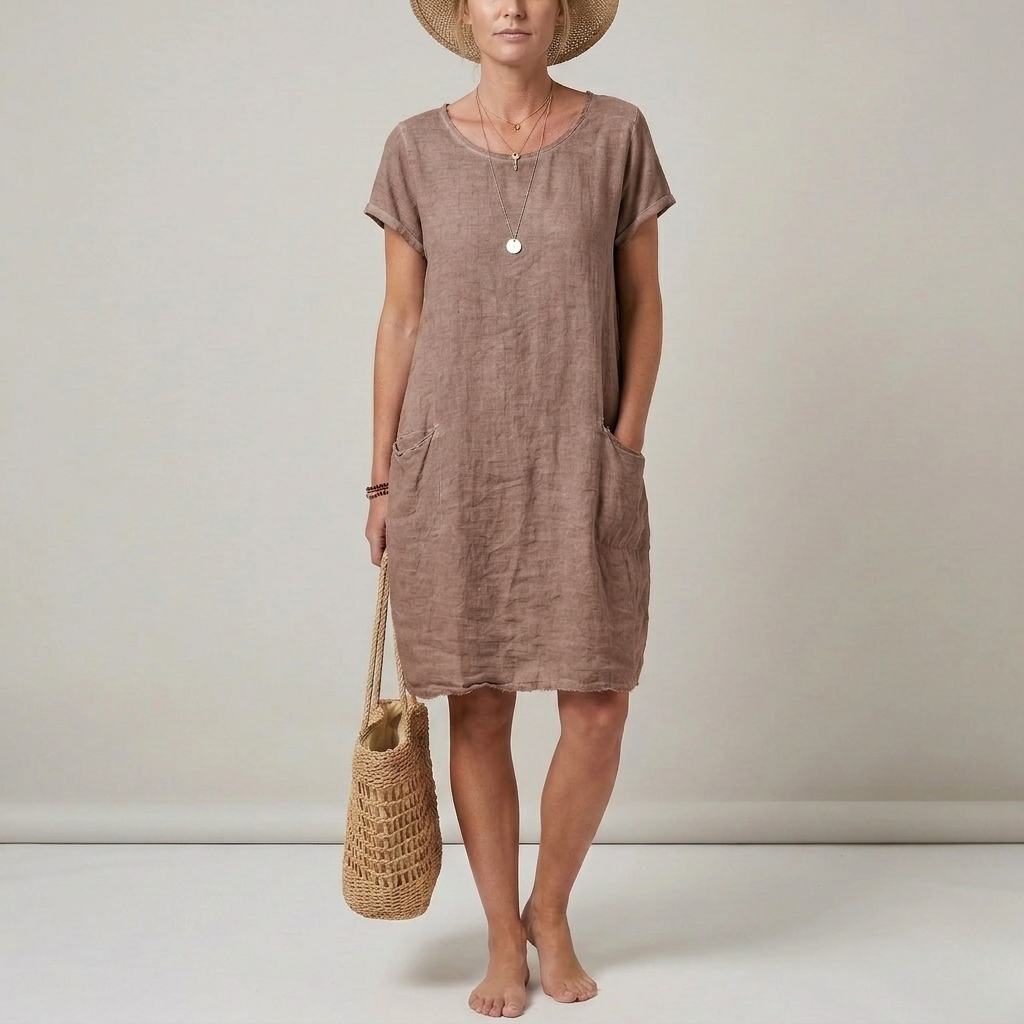 Versatile women's short sleeve mini shift dress with front pockets. A comfortable, casual choice for summer fashion.