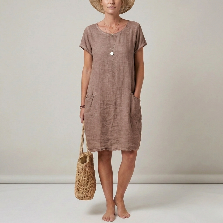 Versatile women's short sleeve mini shift dress with front pockets. A comfortable, casual choice for summer fashion.