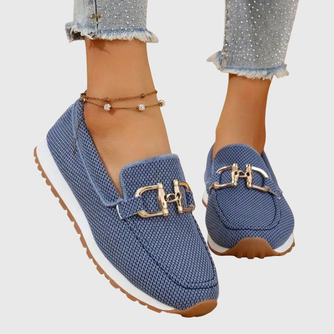 Women's casual orthopedic loafers in a light neutral color, offering comfort and support.