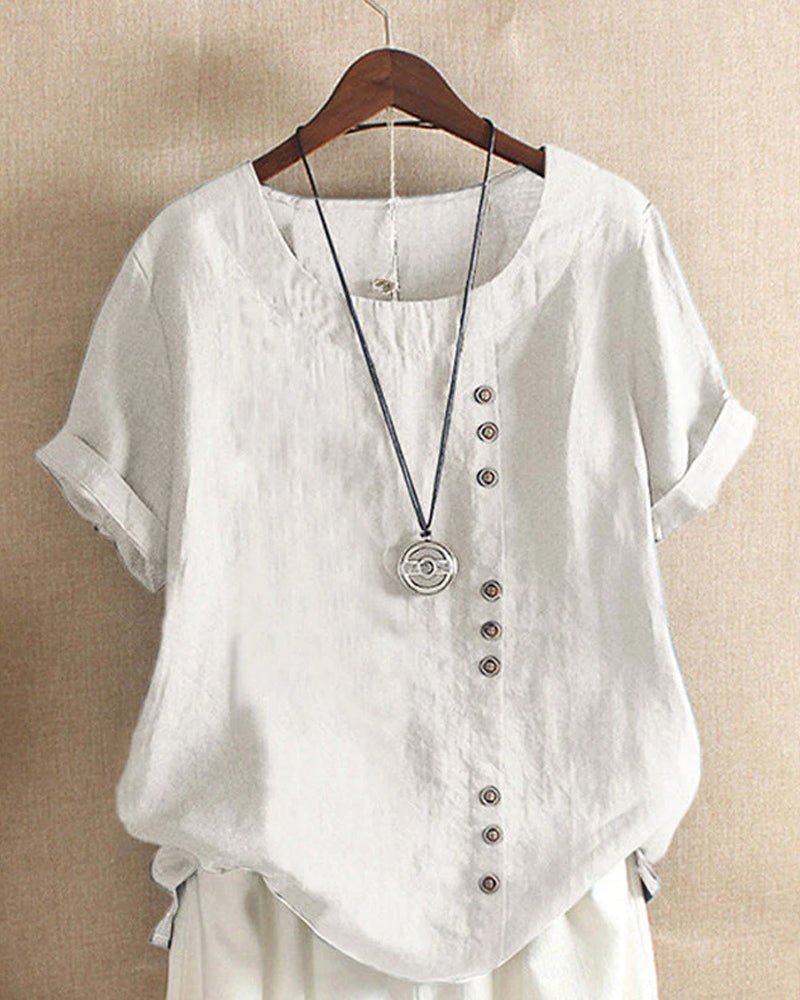 Close-up of button detail on a women's casual short sleeve blouse, versatile and comfortable