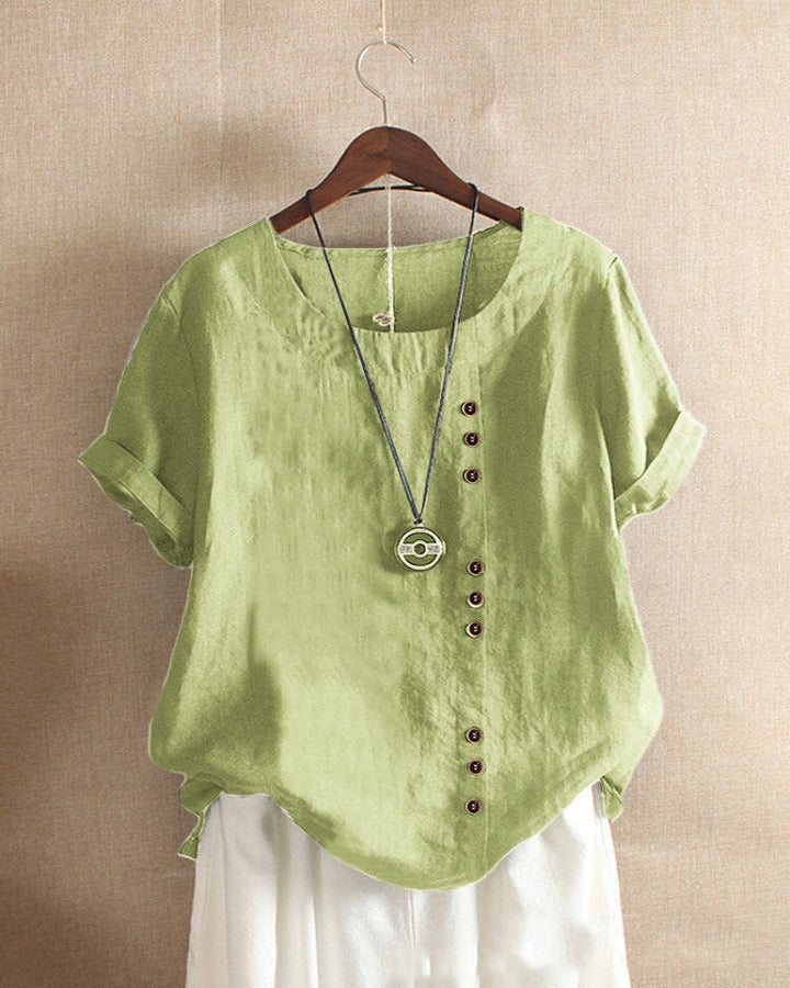 Soft fabric textured women's short sleeve blouse with decorative buttons, a summer essential