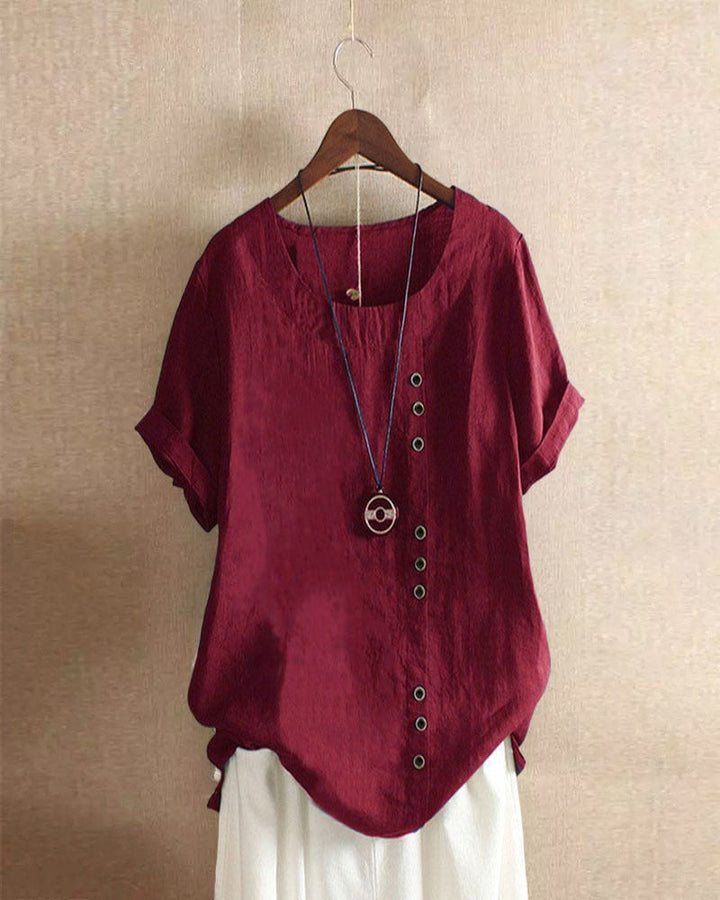 Stylish women's casual short sleeve blouse featuring intricate button detailing for summer outfits