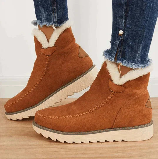 Stylish women's snow boots, waterproof and warm, tan color, designed for ultimate winter comfort and outdoor wear.