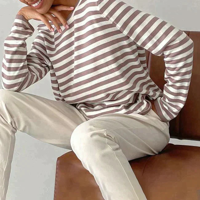 Ladies' relaxed fit striped long sleeve top, ideal for a chic and easygoing spring outfit.