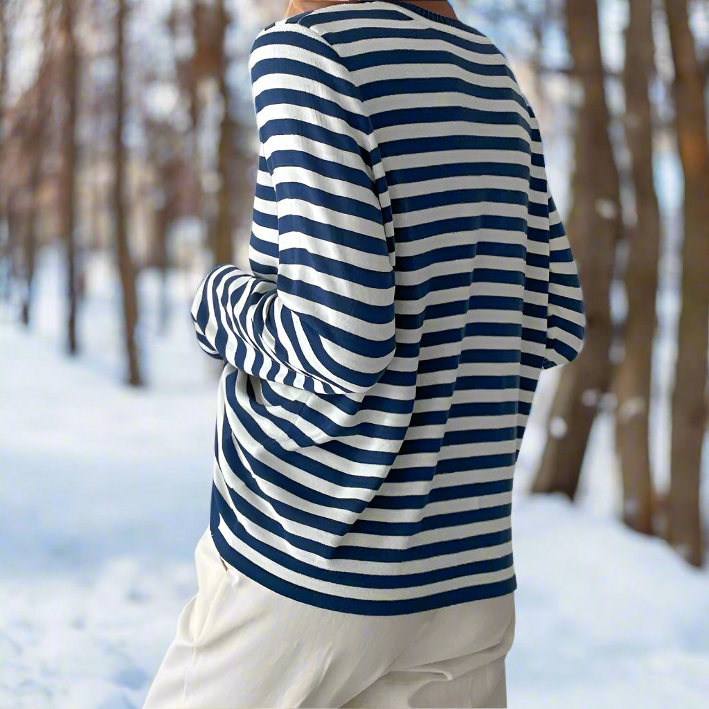 Fashionable women's striped long sleeve top, embodying effortless spring and summer style.