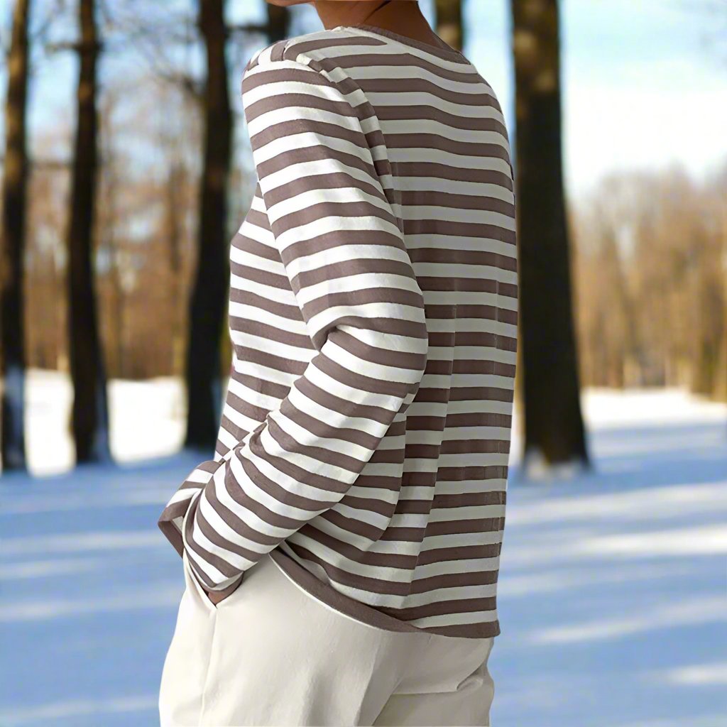 Relaxed fit women's striped long sleeve top, offering comfort and style for everyday wear.