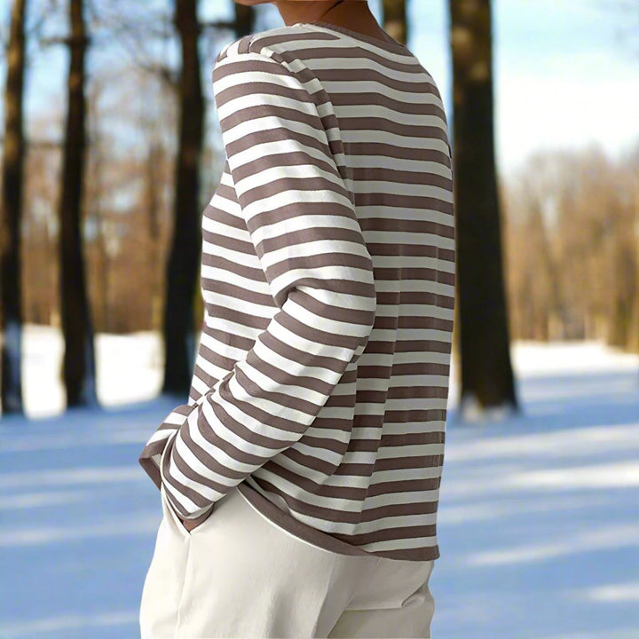 Relaxed fit women's striped long sleeve top, offering comfort and style for everyday wear.