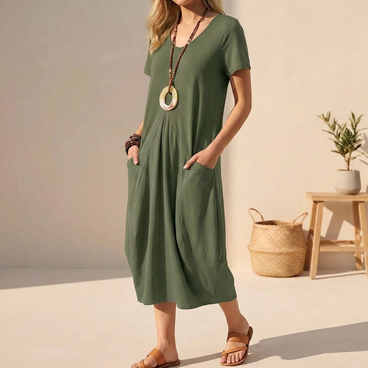 Relaxed fit V-neck midi dress for women, featuring short sleeves and pockets; a comfortable, versatile summer staple.
