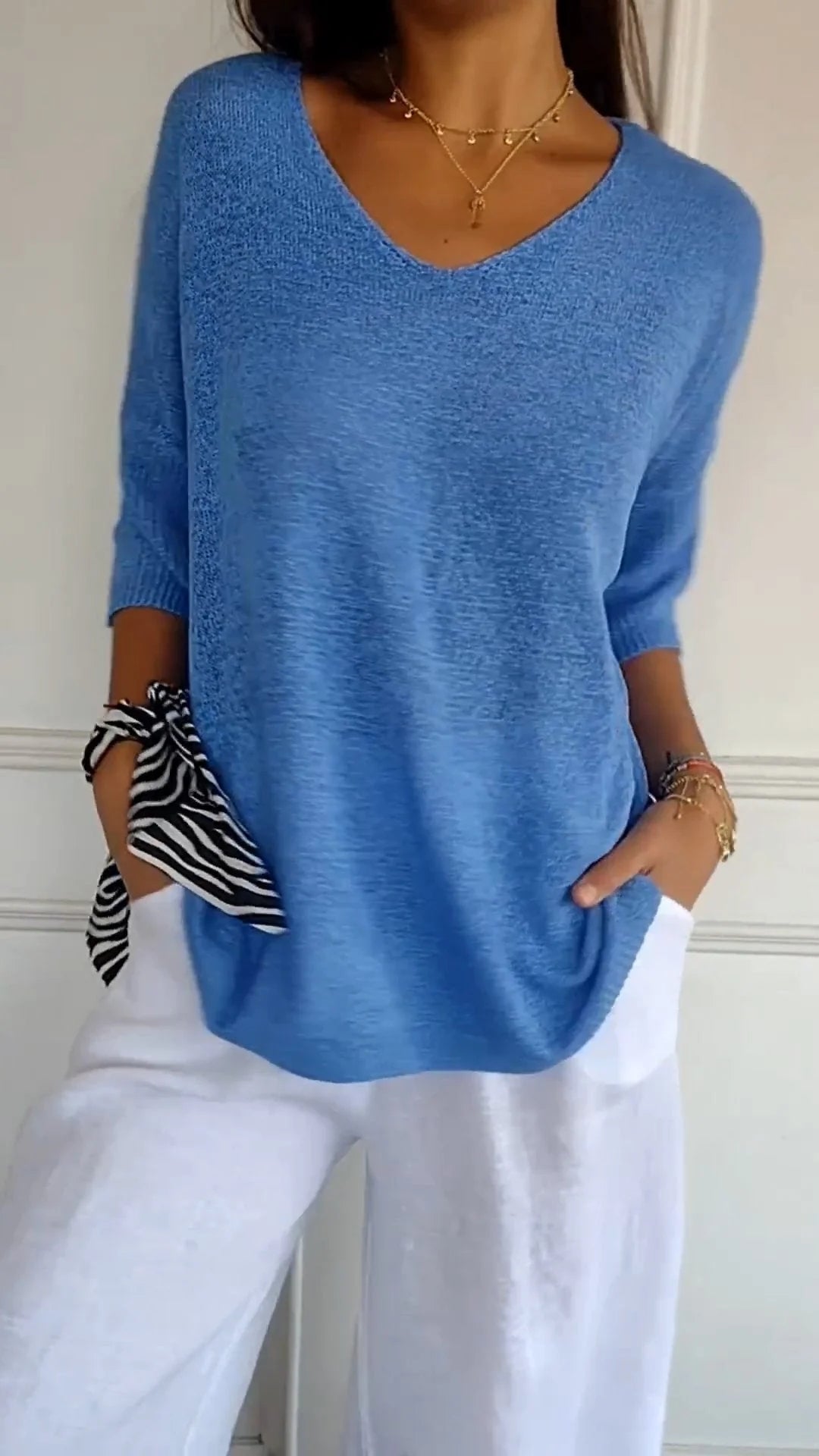 Relaxed fit women's long sleeve v-neck pullover top, perfect for casual wear
