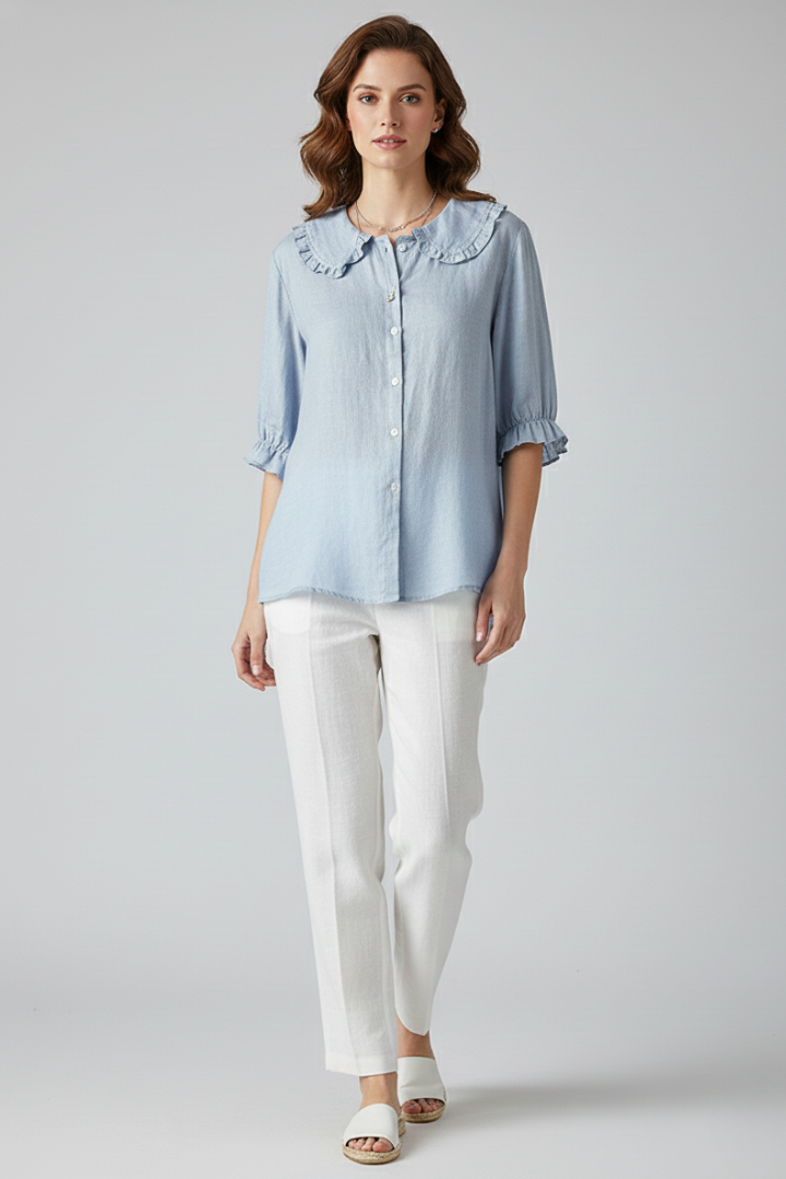 Relaxed fit women's summer blouse with elegant ruffled details and functional buttons.