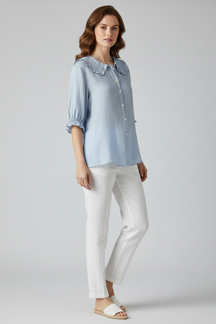 Versatile women's button-front shirt with a ruffled collar, ideal for casual and stylish outfits.