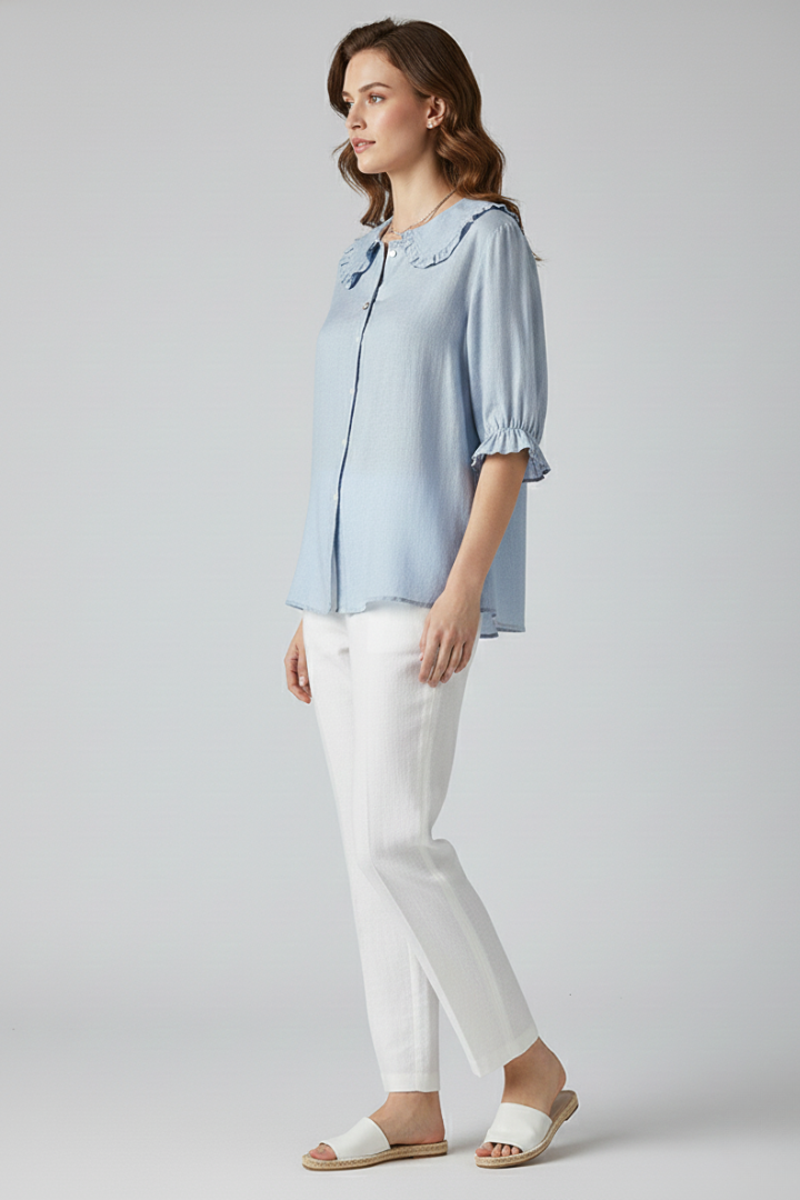 Fashionable women's top featuring a ruffled button-front design, suitable for summer.
