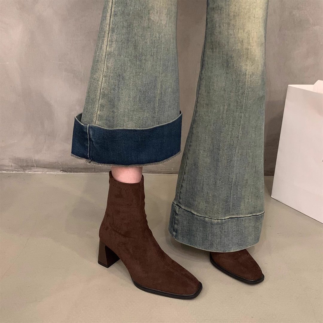 Versatile pointed toe women's ankle boots with a sturdy block heel. Chic black footwear for any fashion occasion.
