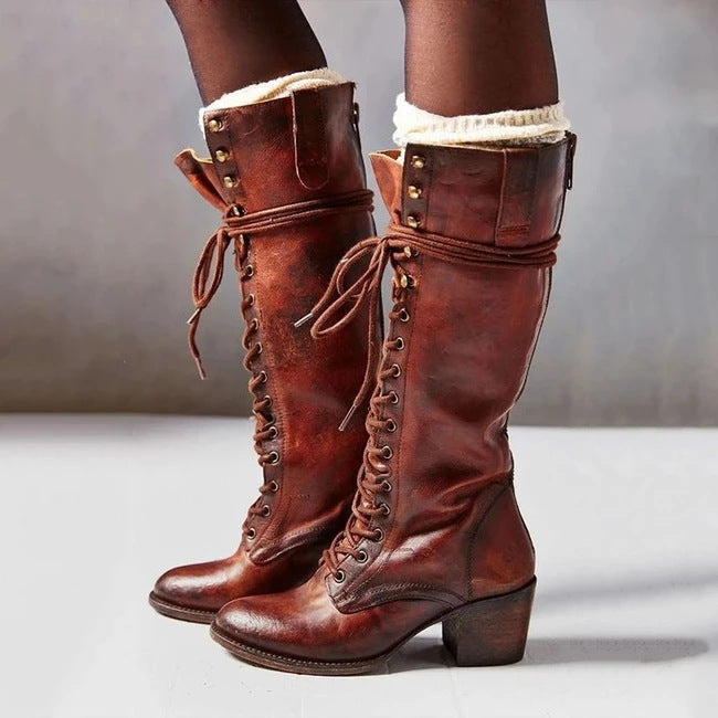 Women's chic black leather lace-up knee boots, elegant tall footwear perfect for winter fashion.
