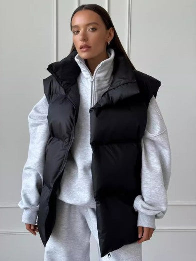 Warm women's puffer vest, sleeveless design. A chic and casual winter layering piece for effortless style.