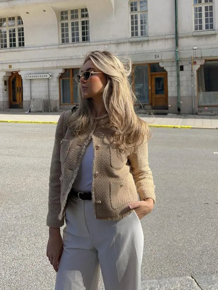 Fashionable women's tweed cropped blazer in black, featuring a sophisticated button-front design, perfect for workwear.