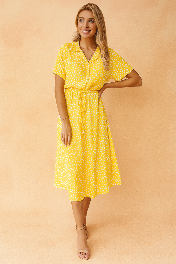 Chic women's polka dot midi dress with a collared, tie-waist design. Effortlessly elegant summer boho style.