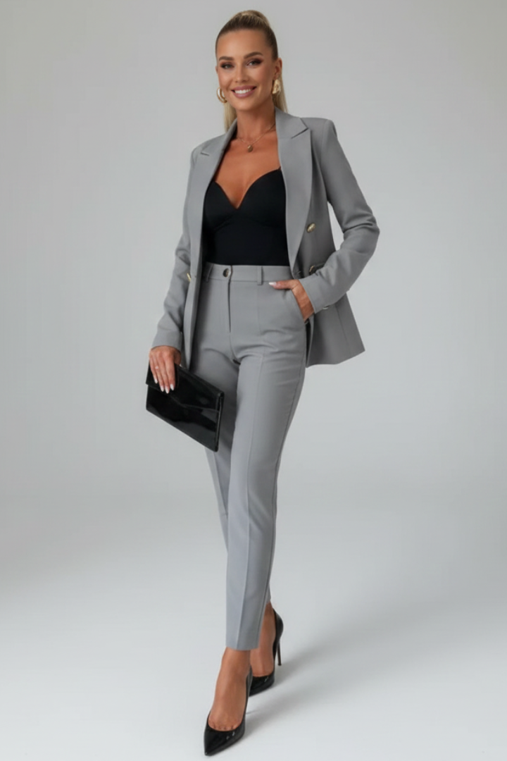 Complete women's double-breasted suit set, featuring a stylish blazer and coordinating trousers.