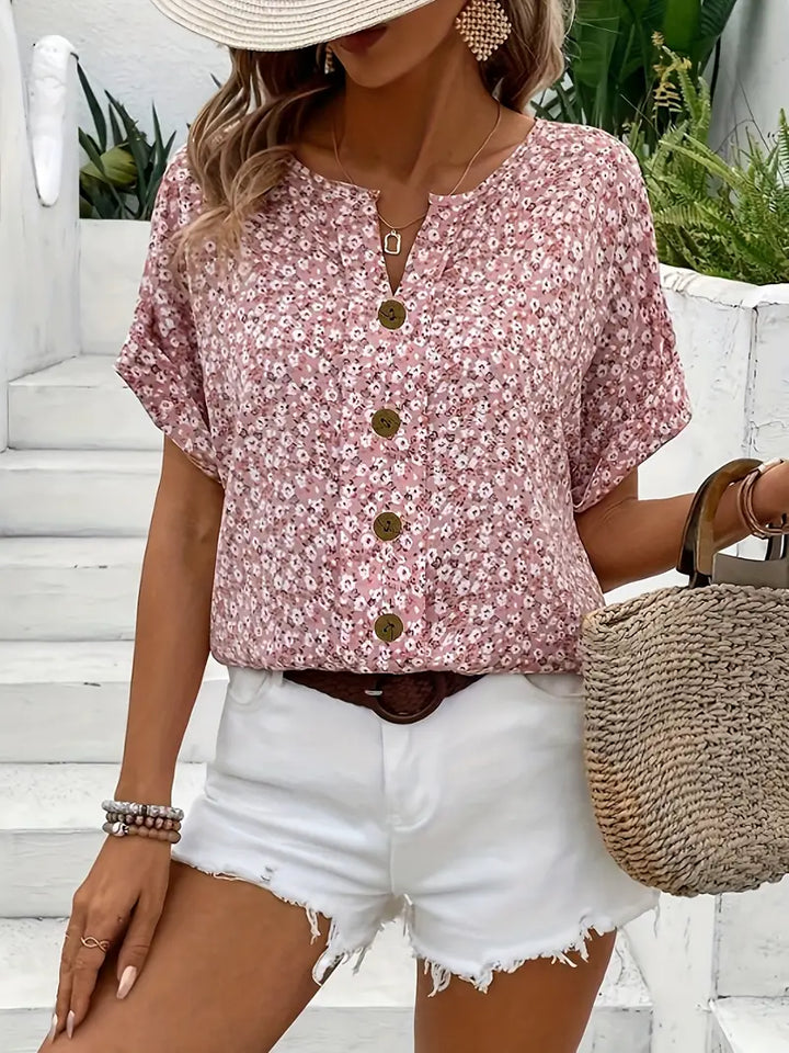 Women's chic floral summer print blouse with a vibrant pattern, perfect for warm weather fashion
