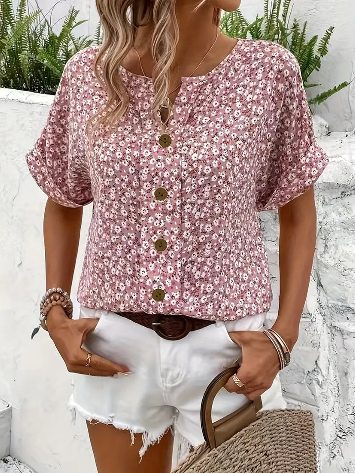 Close-up of a women's chic floral print blouse, highlighting the intricate pattern and soft fabric
