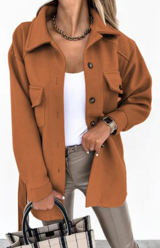 Full shot of a model wearing a women's oversized shirt jacket, highlighting its versatile style
