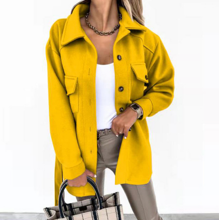 Detail of the oversized pockets on a women's chic wool blend shacket, suitable for everyday fashion